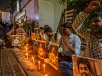 Students hold candles in memory of Sahil Wakode, a second-year IIT Bombay student who died by suicide, during a candlelight tribute on the IIT-Mumbai outside gate, Powai, Mumbai. (Photo by Satish Bate/ Hindustan Times)