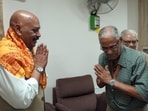 Air Marshal Jitendra Mishra (Retd.) (L) greets a dignitary on his first day as the first CEO of Shri Ram Janmabhoomi Teerth Kshetra Trust in Ayodhya on September 21. (Sourced)