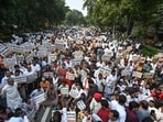 BJP workers raised slogans and marched towards the AAP office, as police attempted to stop them by putting up two barricades. (Sanchit Khanna/HT Photo)