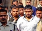 Gangster Sandeep, alias Kala Jathedi, arrives to take part in his daughters’ naming ceremony in Sonepat on Sunday. (HT Photo)