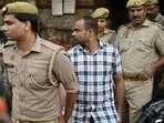 Police escorting Prashant Chaudhary, after the verdict in the Vivek Tiwari murder case. (Deepak Gupta/HT Photo)