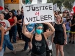 AUSTIN, TEXAS - SEPTEMBER 20: People protest against Immigration and Customs Enforcement (ICE) officers on September 20, 2026 in Austin, Texas. A federal ICE officer shot and wounded a person earlier this afternoon in North Austin.   Brandon Bell/Getty Images/AFP (Photo by Brandon Bell / GETTY IMAGES NORTH AMERICA / Getty Images via AFP)
