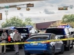 AUSTIN, TEXAS - SEPTEMBER 20: Law enforcement monitor a vehicle that was shot at by Immigration and Customs Enforcement officers on September 20, 2026 in Austin, Texas. A federal ICE officer shot and wounded a person earlier this afternoon in North Austin.   Brandon Bell/Getty Images/AFP (Photo by Brandon Bell / GETTY IMAGES NORTH AMERICA / Getty Images via AFP)