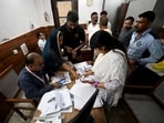 Voters arrive at a voter centre to seek clarification and make correction to their SIR forms. (Ishant Chauhan/HT Photo)