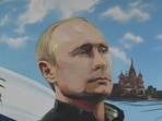 A mural depicting Russian President Vladimir Putin during Russia's parliamentary election at a polling station in Donetsk, Russian-controlled Ukraine.