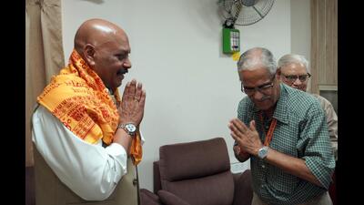 Air Marshal Jitendra Mishra (Retd.) (L) greets a dignitary on his first day as the first CEO of Shri Ram Janmabhoomi Teerth Kshetra Trust in Ayodhya on September 21. (Sourced) Air Marshal Jitendra Mishra (Retd.) (L) greets a dignitary on his first day as the first CEO of Shri Ram Janmabhoomi Teerth Kshetra Trust in Ayodhya on September 21. (Sourced)