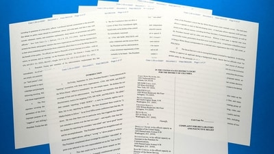 The lawsuit filed by CNN, MS NOW and Politico against the administration of U.S. President Donald Trump is photographed. (AP Photo/Jon Elswick)