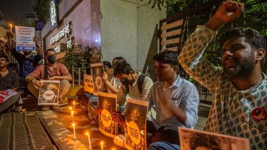 Students hold candles in memory of Sahil Wakode, a second-year IIT Bombay student who died by suicide, during a candlelight tribute on the IIT-Mumbai outside gate, Powai, Mumbai. (Photo by Satish Bate/ Hindustan Times)