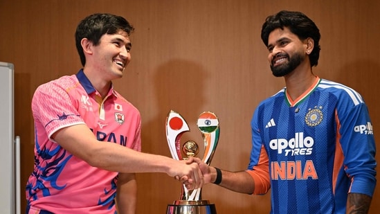 Shreyas Iyer shakes hands with Japanese captain Kendel Kadowaki-Fleming.