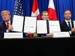 President Donald Trump signs a security agreement with Denmark's Prime Minister Mette Frederiksen and Greenland's Prime Minister Jens-Frederik Nielsen during the United Nations General Assembly.(AP)