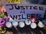 Flowers and candles are seen near the site where a Venezuelan man was shot in his vehicle by an ICE officer in Austin, Texas, Monday, Sept. 21, 2026. (AP Photo/Eric Gay)(AP Photo/Eric Gay)