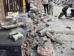 MCG demolish a ramp in front of a building in Shivpuri on Monday. (HT/Sourced)