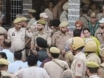 Policemen at the spot where villagers organised a protest in Sai Sardari village of the RS Pura sector in Jammu district.