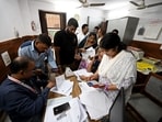 Voters arrive at a voter center to seek clarification and make correction to their SIR Forms at Laxmi Devi School Sadar Bazar, in New Delhi.(Ishant Chauhan/HT)