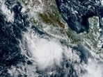 This handout satellite image obtained from the National Oceanic and Atmospheric Administration (NOAA)/GOES shows Hurricane Polo over the Pacific Ocean near Mexico.