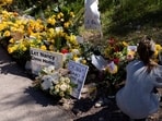 A delivery driver drops off yellow flowers at the house of Nancy Guthrie, the 84-year-old mother of U.S. journalist and television host Savannah Guthrie, who went missing from her home on February 1, in Tucson, U.S. February 21, 2026.  REUTERS/Rebecca Noble/File Photo