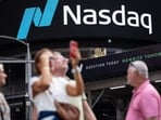 Nasdaq hits record high as oil prices fall and US-Iran talks lift market sentiment. 
