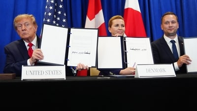 President Donald Trump signs a security agreement with Denmark's Prime Minister Mette Frederiksen and Greenland's Prime Minister Jens-Frederik Nielsen during the United Nations General Assembly. (AP) President Donald Trump signs a security agreement with Denmark's Prime Minister Mette Frederiksen and Greenland's Prime Minister Jens-Frederik Nielsen during the United Nations General Assembly. (AP)
