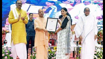 Uttar Pradesh CM Yogi Adityanath distributing an appointment letter to a candidate at an event in Lucknow on September 22. (ANI) Uttar Pradesh CM Yogi Adityanath distributing an appointment letter to a candidate at an event in Lucknow on September 22. (ANI)