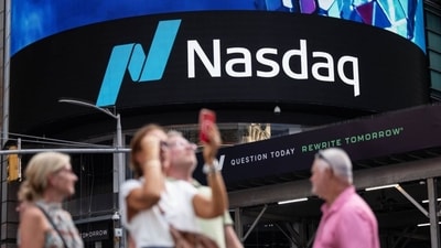 Nasdaq hits record high as oil prices fall and US-Iran talks lift market sentiment.