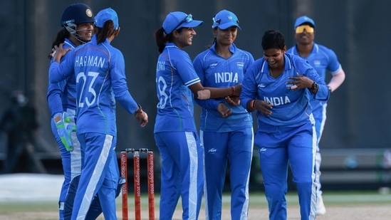 India's players celebrate a wicket in the women's gold medal cricket match between India and Sri Lanka during the 2026 Asian Games at Korogi Athletic Park