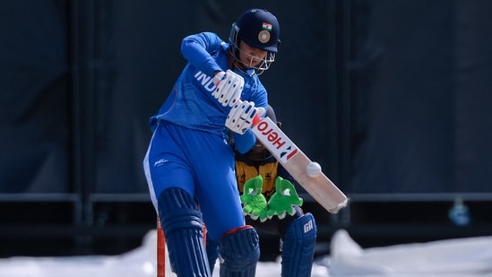 India's Smriti Mandhana plays a shot in front of Sri Lanka's wicketkeeper Kaushini Nuthyangana in the women's gold medal cricket match between India and Sri Lanka during the 2026 Asian Games 