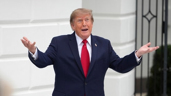 President Donald Trump speaks as he arrives to cut the ribbon on a new helipad on the South Lawn of the White House, Sept. 21, 2026, in Washington.