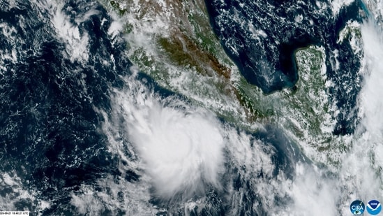 This handout satellite image obtained from the National Oceanic and Atmospheric Administration (NOAA)/GOES shows Hurricane Polo over the Pacific Ocean near Mexico.