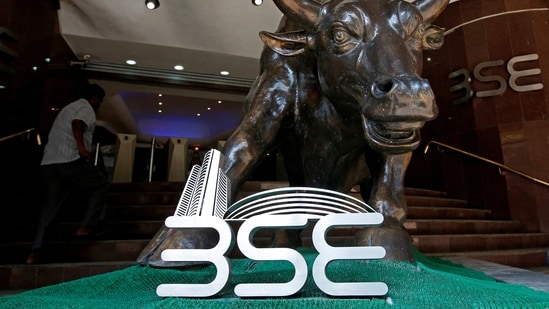 File Photo: The Bombay Stock Exchange logo is seen under a bull statue at the entrance of their building in Mumbai
