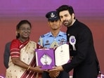 President Droupadi Murmu presents Best Actor in a Leading Role award to Actor Kartik Aaryan for Chandu Champion at the 72nd National Film Awards ceremony, in Kevadia on Tuesday. (@Bhupendrapbjp X/ANI Photo)