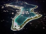 This image released by the U.S. Navy shows an aerial view of Diego Garcia in the Chagos Island group. (U.S. Navy via AP, File)