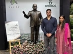 Vikram Pai with a statue of his grandfather, RK Baliga, who founded Electronic City in Bengaluru. 