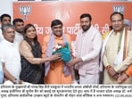 Haryana CM Nayab Singh Saini along with BJP state president Archana Gupta felicitating the newly appointed OBC morcha president Sunil Sen in Panchkula on Tuesday. (HT)