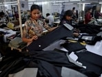 FILE PHOTO: FILE PHOTO: Workers check trousers at a garment manufacturing unit on the outskirts of Ahmedabad, India, January 29, 2026.