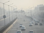 Ghaziabad: Vehicles ply with their headlights amid dense smog on the Delhi-Meerut Expressway and National Highway-9 near Dasna