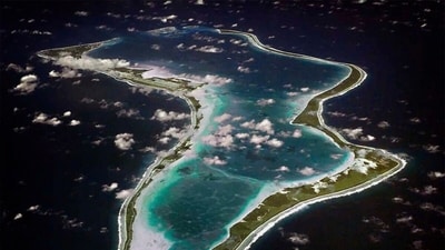 This image released by the U.S. Navy shows an aerial view of Diego Garcia in the Chagos Island group. (U.S. Navy via AP, File)