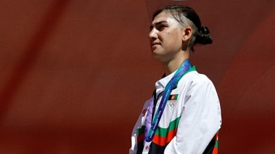 2026 Silver medallist Afghanistan's Fariba Hashimi stands on the podium during the victory ceremony (REUTERS)