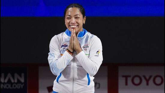 India’s Mirabai Chanu wins a silver medal in the Women’s 49kg Group A weightlifting final match during the Asian Games, in Nagoya, Japan. (PTI)
