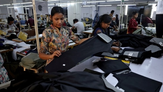 FILE PHOTO: FILE PHOTO: Workers check trousers at a garment manufacturing unit on the outskirts of Ahmedabad, India, January 29, 2026.