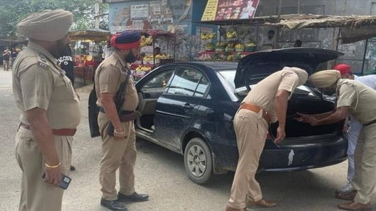 A bullet narrowly missed the police officer, while the suspect sustained a gunshot injury in retaliatory firing and was taken to a hospital.