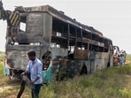 A view of the charred sleeper bus after it caught fire, allegedly caused by the driver and cleaner's continuous smoking on the Yamuna Expressway, in Greater Noida on Thursday. (ANI Video Grab)