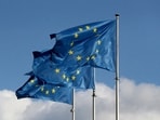 European Union flags fly outside the EU Commission headquarters in Brussels.