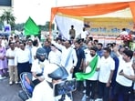 Deputy chief minister Brajesh Pathak flags off an Ayurveda Day bike rally in Lucknow. (HT Photo)
