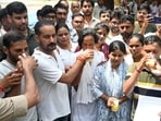 District magistrate Manish Verma and police commissioner Piyush Mordia offer juice to protesters to end their fast on Wednesday. (Anil Kumar Maurya/HT)