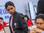 Indian IM Savitha Shri, who has won all her seven games, watches teammate Koneru Humpy’s game in the Fide Chess Olympiad in Samarkand. (FIDE)