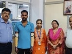 Neeraj Yadav, 22, of Bhadohi with the medical team (HT Photo)