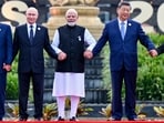 Russian President Vladimir Putin, Prime Minister Narendra Modi and Chinese President Xi Jinping pose for a group photograph at 18th BRICS Summit, in New Delhi.