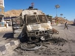 Charred remains of a vehicle lies in the aftermath of violent clashes between demonstrators and police during a protest in Leh, Thursday, Sept. 25, 2025.(PTI)