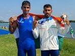 Indian rowers Satnam Singh and Salman Khan pose with their bronze medal 