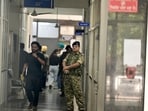 Security personnel standing guard during the Enforcement Directorate raid on the Greater Mohali Area Development Authority (GMADA) headquarters on Wednesday. (Ravi Kumar/HT)
